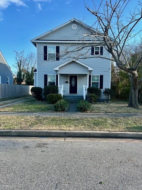 view of front of home with a front lawn