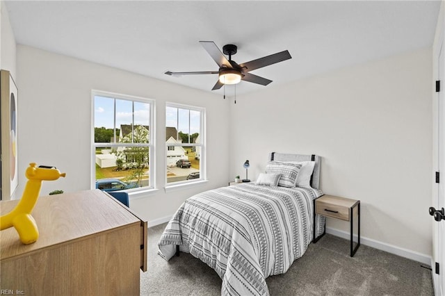 bedroom featuring ceiling fan and dark colored carpet