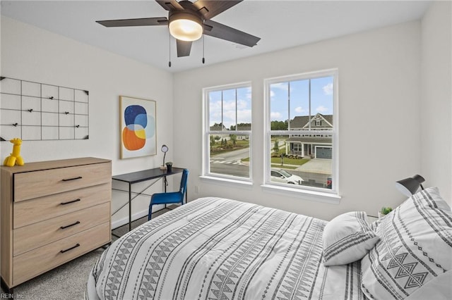 bedroom with ceiling fan and carpet flooring