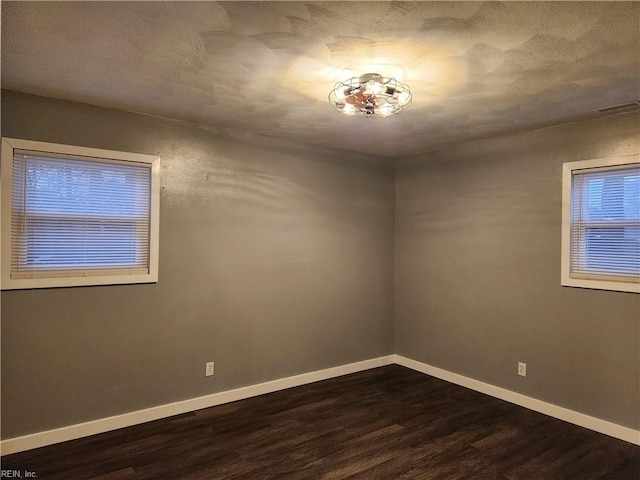 empty room featuring dark hardwood / wood-style floors