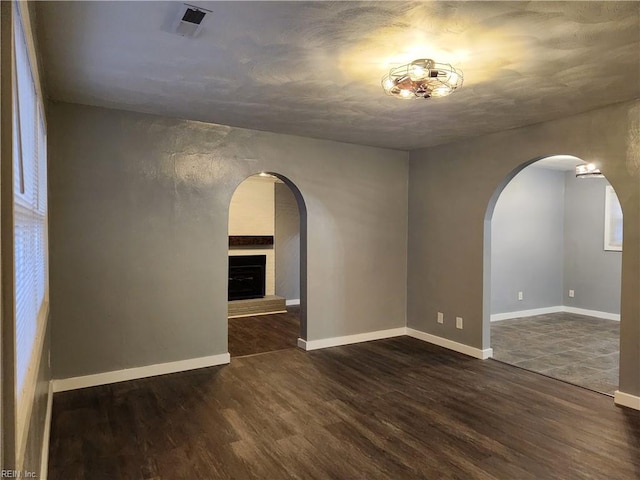 spare room with dark hardwood / wood-style floors