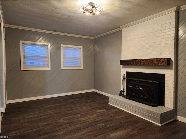 unfurnished living room with crown molding, wooden walls, and dark hardwood / wood-style floors