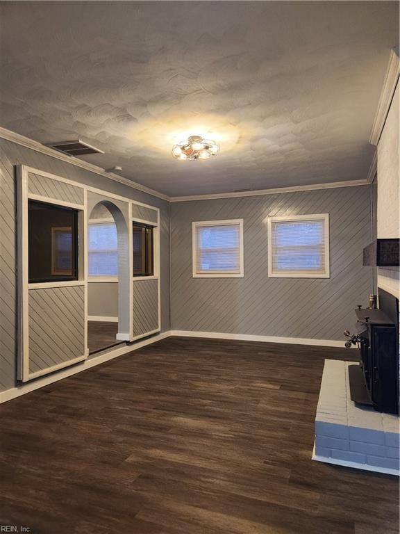 interior space with crown molding and dark wood-type flooring