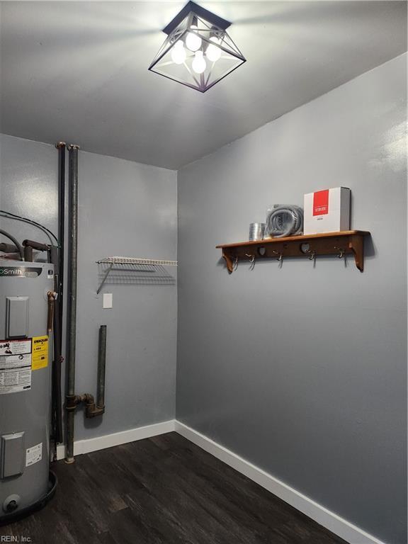 utility room with water heater