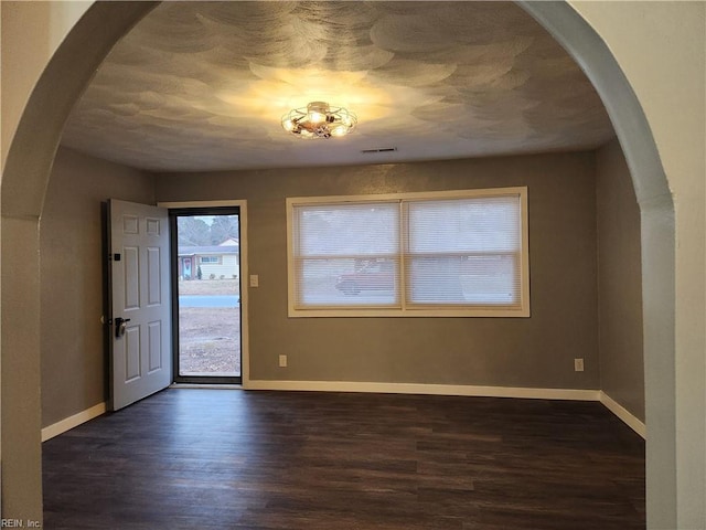 foyer with dark hardwood / wood-style floors