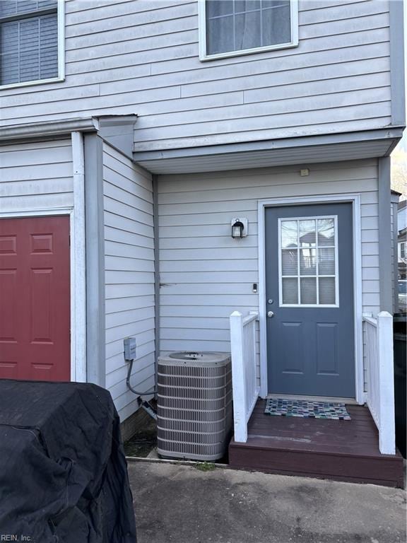 entrance to property featuring central AC