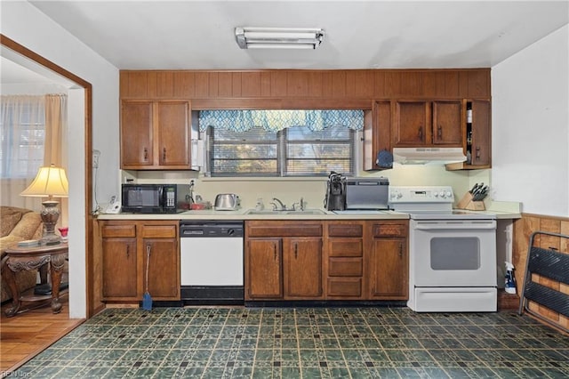 kitchen with sink and white appliances