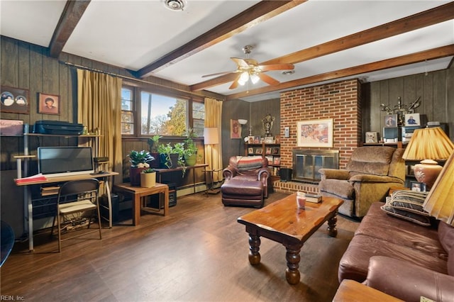 living room featuring beamed ceiling, hardwood / wood-style flooring, a fireplace, and wooden walls