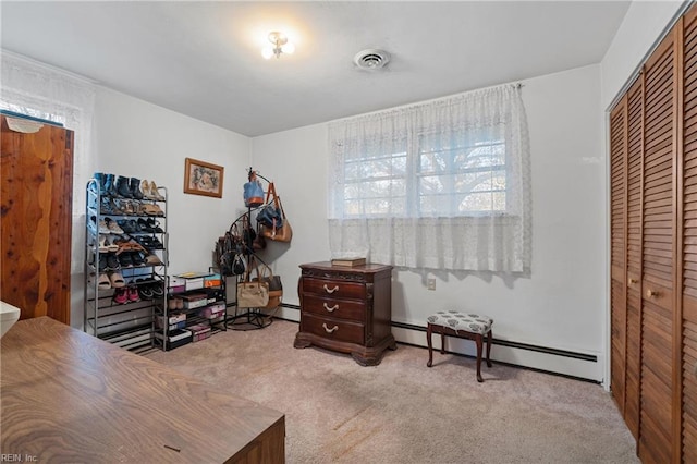 office featuring light carpet and a baseboard radiator