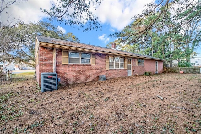 ranch-style home featuring central AC unit