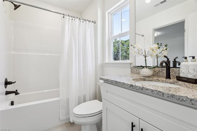 full bathroom featuring toilet, vanity, and shower / bath combination with curtain