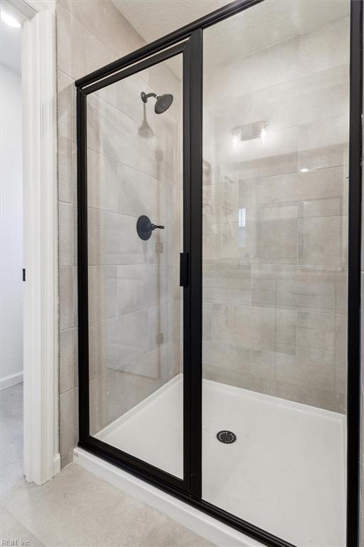 bathroom featuring an enclosed shower