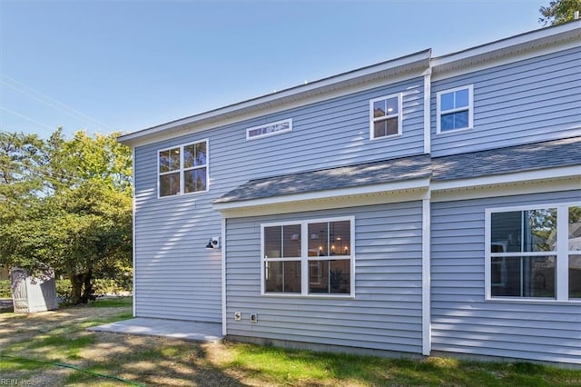 rear view of property featuring a patio