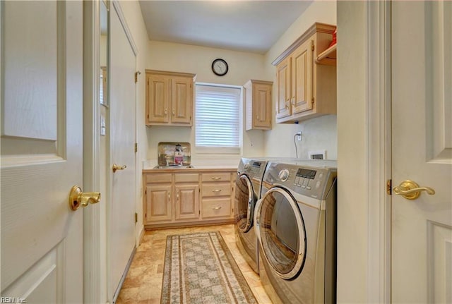 laundry area with cabinets, independent washer and dryer, and sink