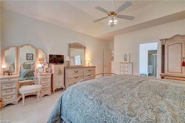 carpeted bedroom featuring ceiling fan and vaulted ceiling