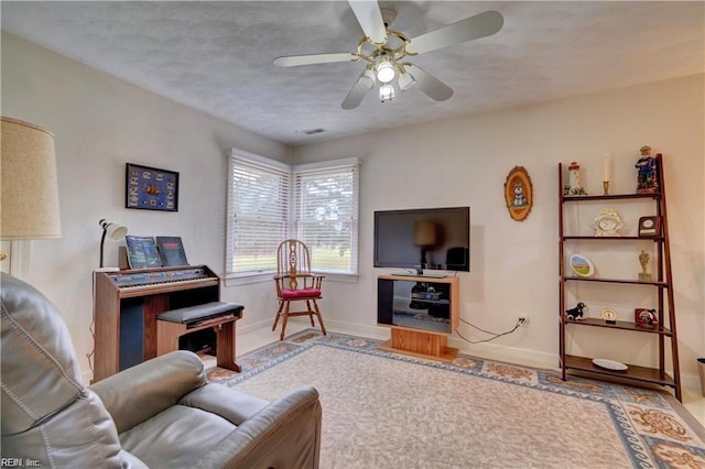 living room with ceiling fan