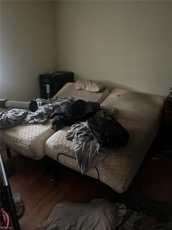 bedroom with wood-type flooring