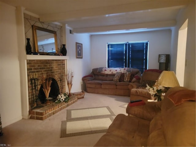 living room featuring carpet, beam ceiling, and a brick fireplace