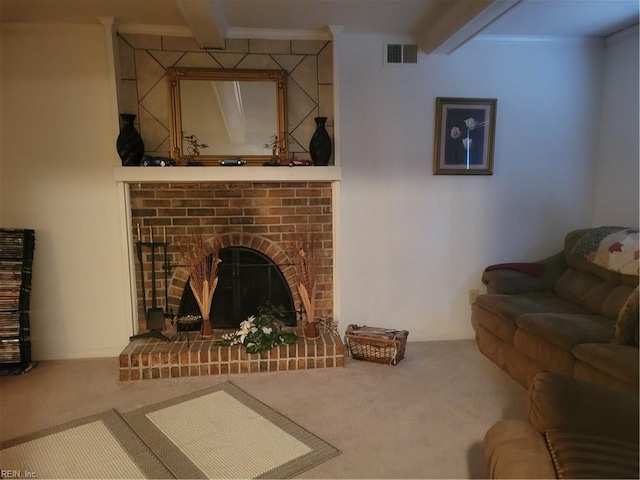 carpeted living room featuring beamed ceiling and a brick fireplace