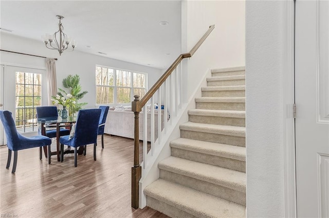 interior space with hardwood / wood-style floors and a chandelier