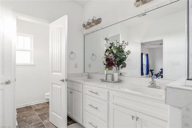 bathroom with vanity and toilet