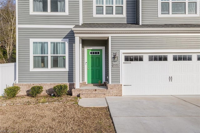 view of exterior entry featuring a garage