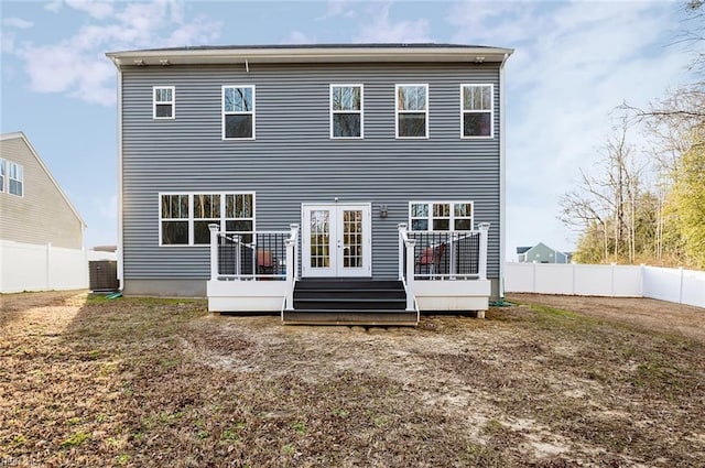 back of house featuring french doors and a deck