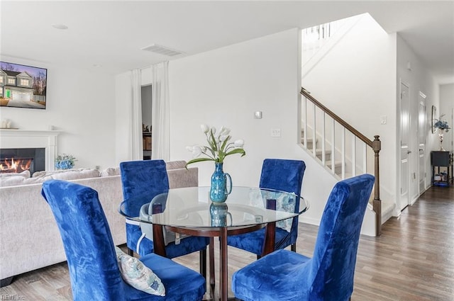 dining area with dark hardwood / wood-style flooring