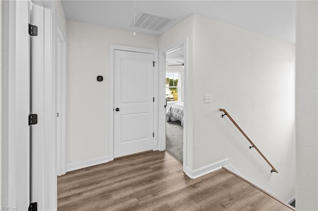 corridor featuring hardwood / wood-style flooring