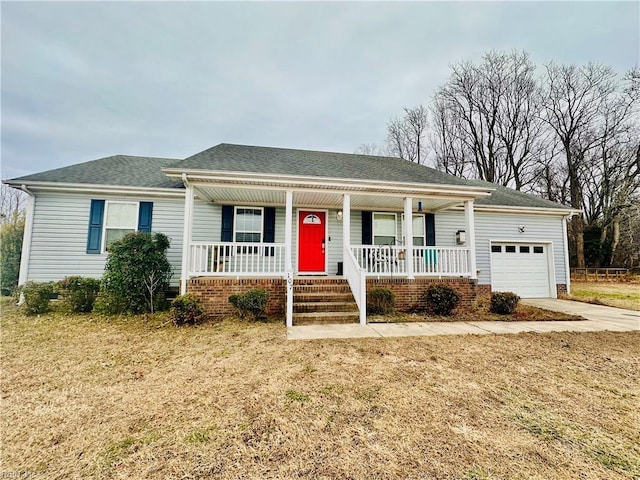 ranch-style house featuring a garage, a front yard, and a porch