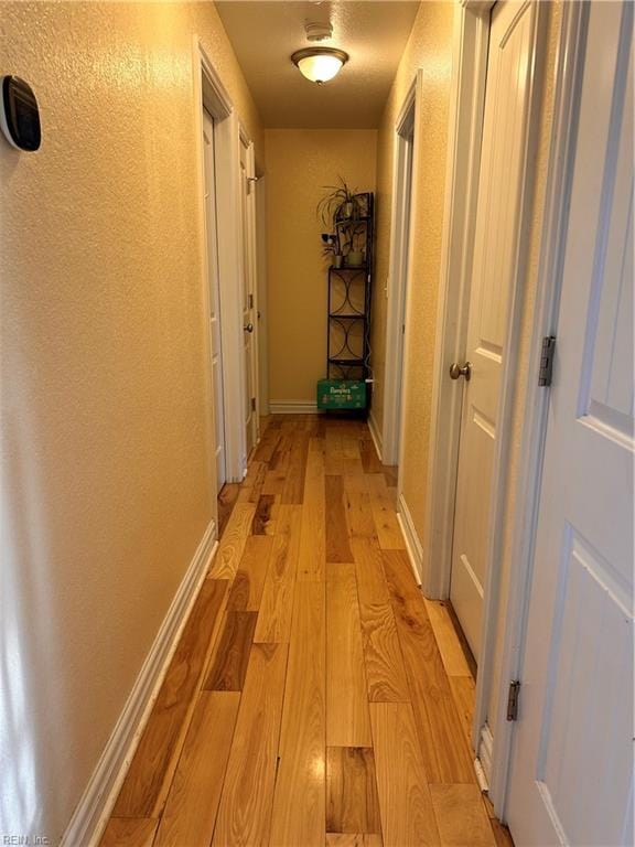 hall featuring light hardwood / wood-style flooring