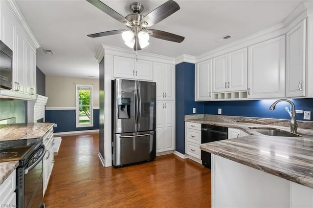 kitchen with sink, white cabinetry, black appliances, and dark hardwood / wood-style flooring