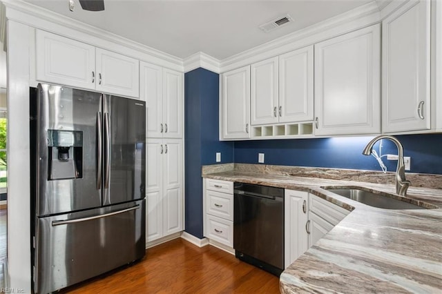 kitchen with stainless steel refrigerator with ice dispenser, white cabinetry, black dishwasher, and sink