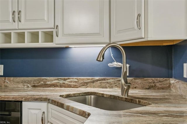 kitchen with sink and white cabinetry