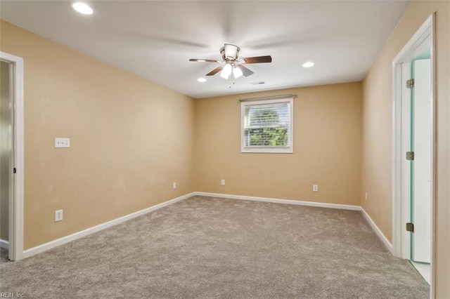 carpeted empty room with ceiling fan