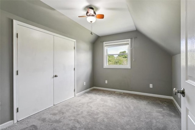 bonus room with ceiling fan, light carpet, and vaulted ceiling