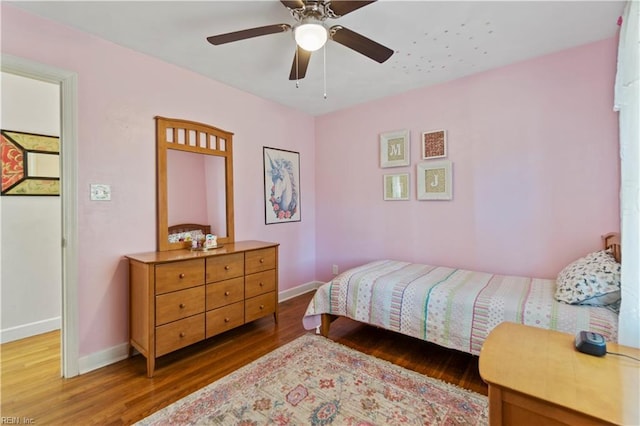 bedroom featuring ceiling fan and wood-type flooring