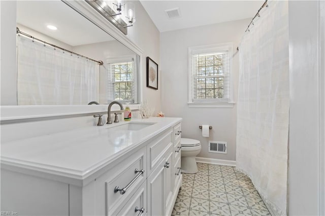 bathroom with toilet and vanity