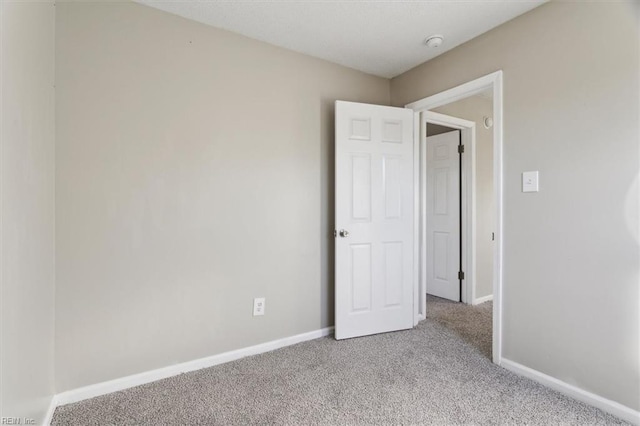 unfurnished bedroom featuring light colored carpet