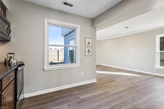 unfurnished dining area featuring hardwood / wood-style floors