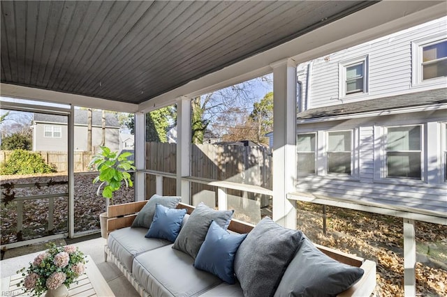 sunroom featuring wooden ceiling