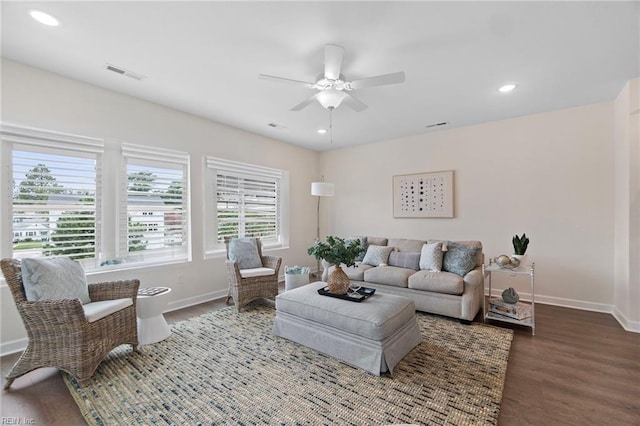 living room featuring ceiling fan and hardwood / wood-style floors