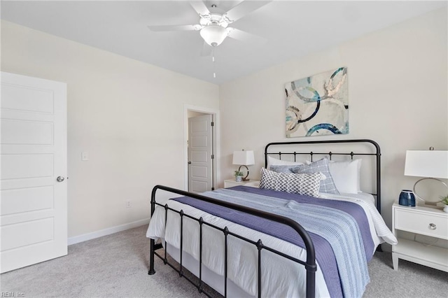 bedroom featuring ceiling fan and light colored carpet