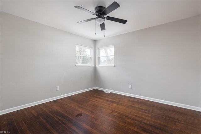 empty room with hardwood / wood-style floors and ceiling fan