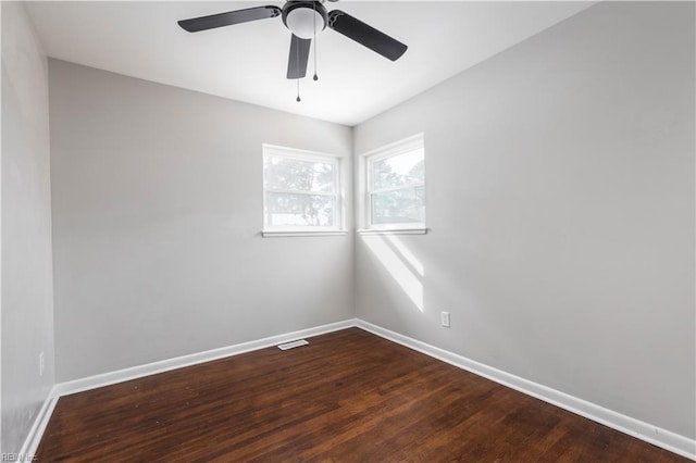 empty room featuring ceiling fan and hardwood / wood-style floors