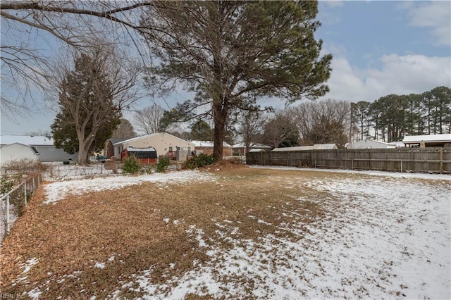 view of yard covered in snow