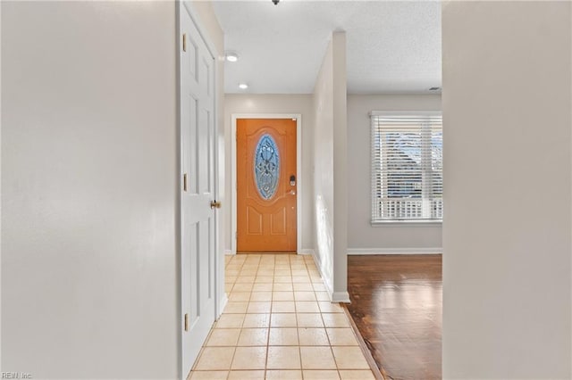 foyer entrance featuring light tile patterned flooring