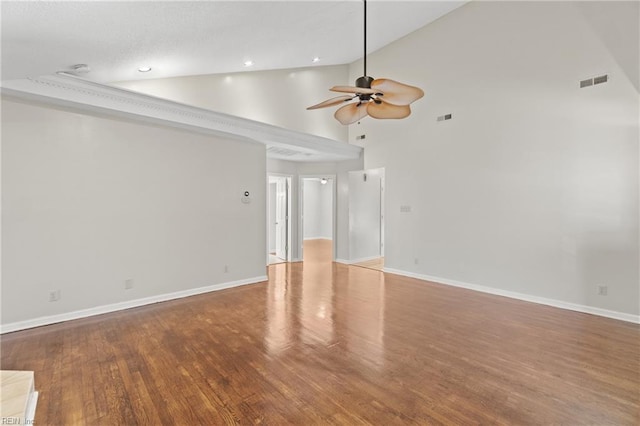 spare room featuring high vaulted ceiling, ceiling fan, and hardwood / wood-style floors