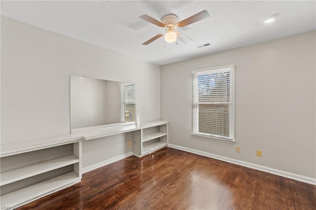 interior space featuring a textured ceiling, ceiling fan, and hardwood / wood-style flooring