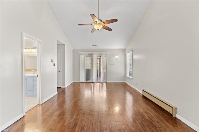 interior space featuring ceiling fan, sink, high vaulted ceiling, dark hardwood / wood-style flooring, and a baseboard radiator